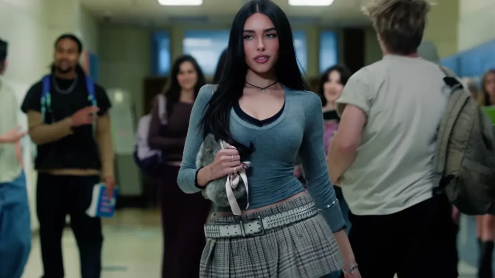 Official “Make You Mine” music video still showing Madison Beer walking through a school hallway