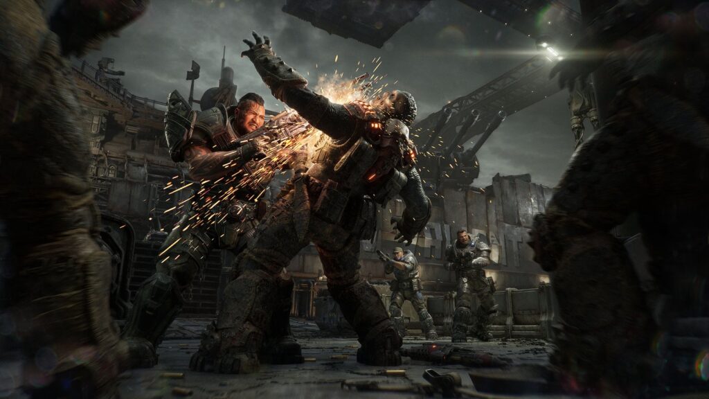 Gears of War: E-Day Goes Gold, Final PC Specs Revealed Marcus Fenix fighting a Locust enemy in a brutal close-range multiplayer scene with sparks and other COG soldiers behind