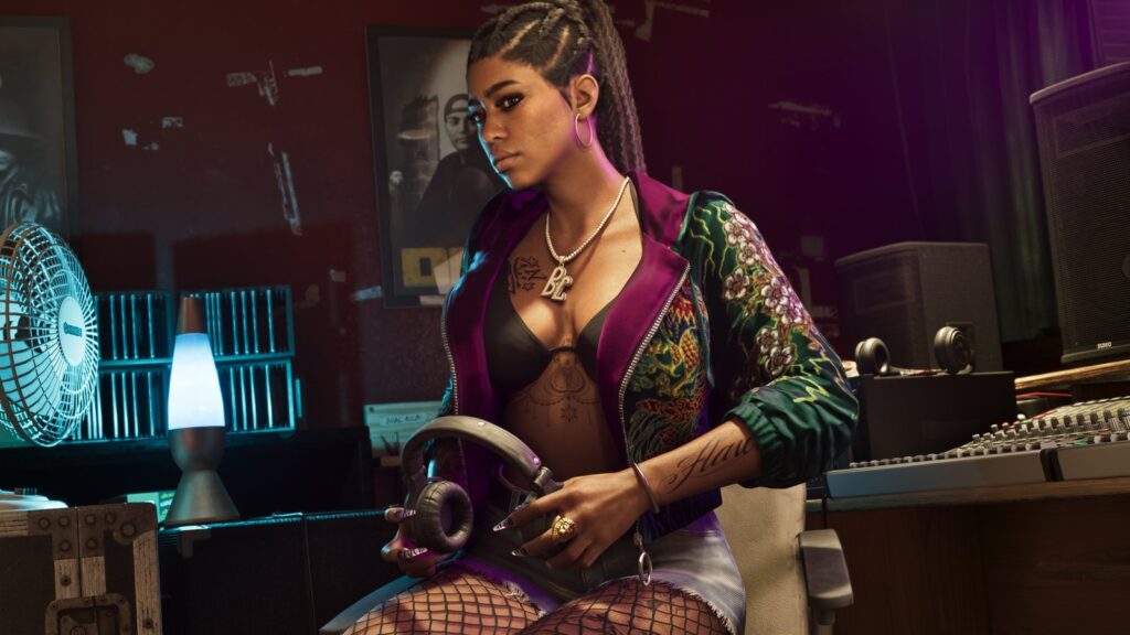 GTA VI Music Rollout Expands With Six New Artist Artworks Official GTA VI screenshot showing Bae-Luxe of Real Dimez seated in a recording studio holding headphones