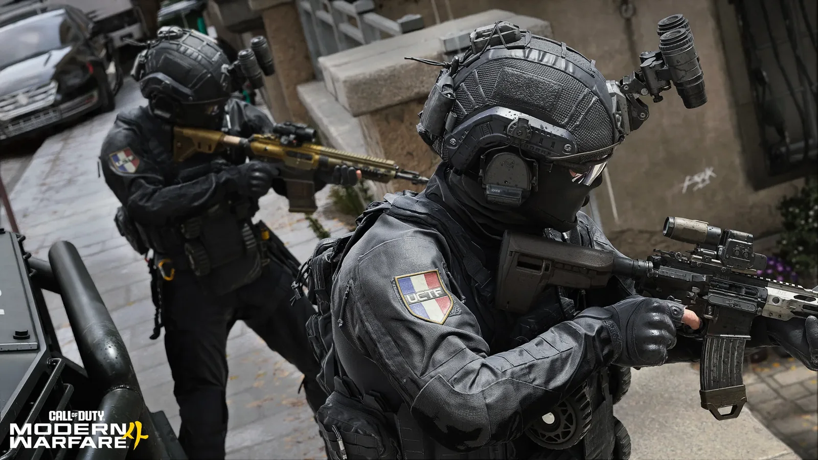 Official Modern Warfare 4 multiplayer screenshot showing two armed operators advancing through an urban combat area