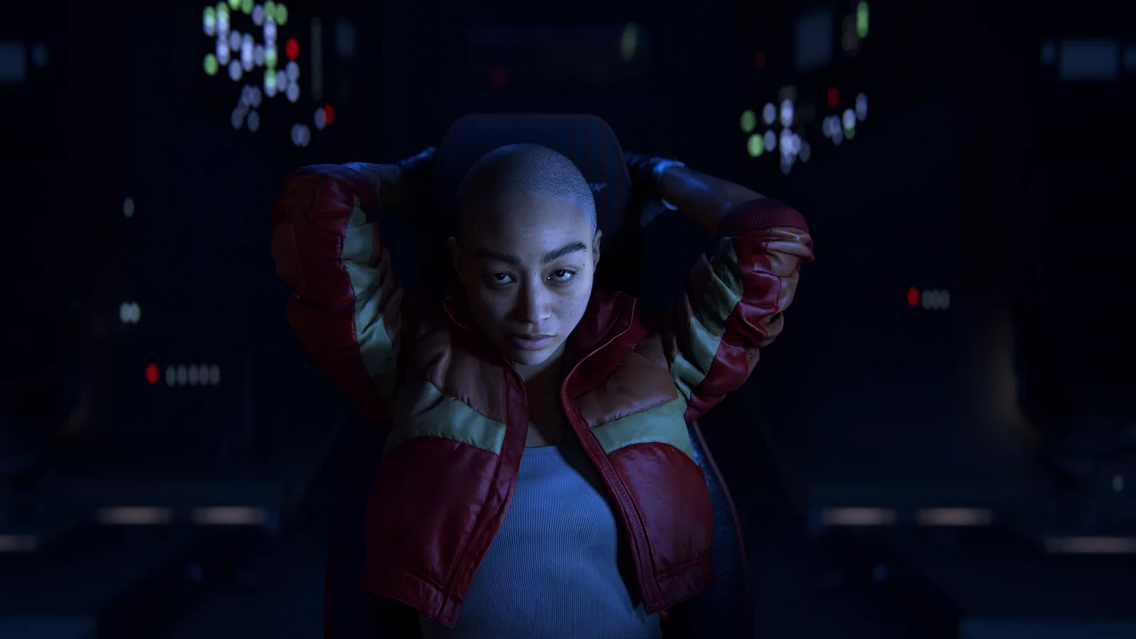 Jordan A. Mun seated inside her spacecraft in her red jacket