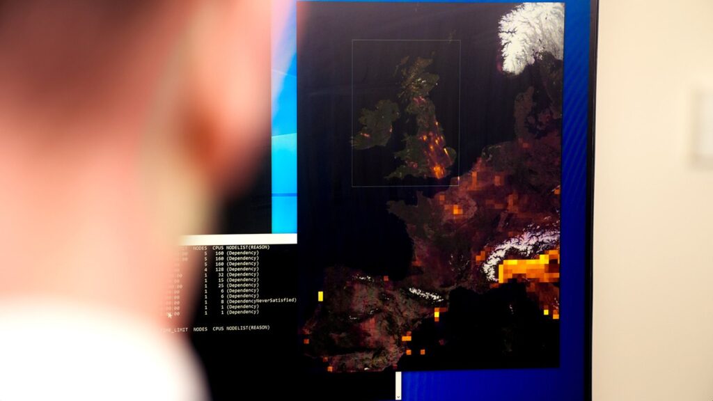 NVIDIA Earth-2 Speeds Up UK-Wide Air Pollution Forecasting University of Manchester researcher viewing a UK-wide air pollution model on a desktop monitor
