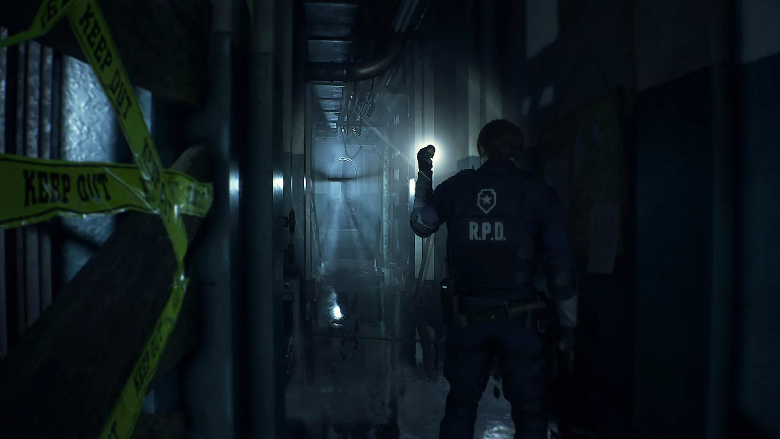Official Resident Evil 2 remake gameplay screenshot showing Leon S. Kennedy exploring a dark Raccoon City Police