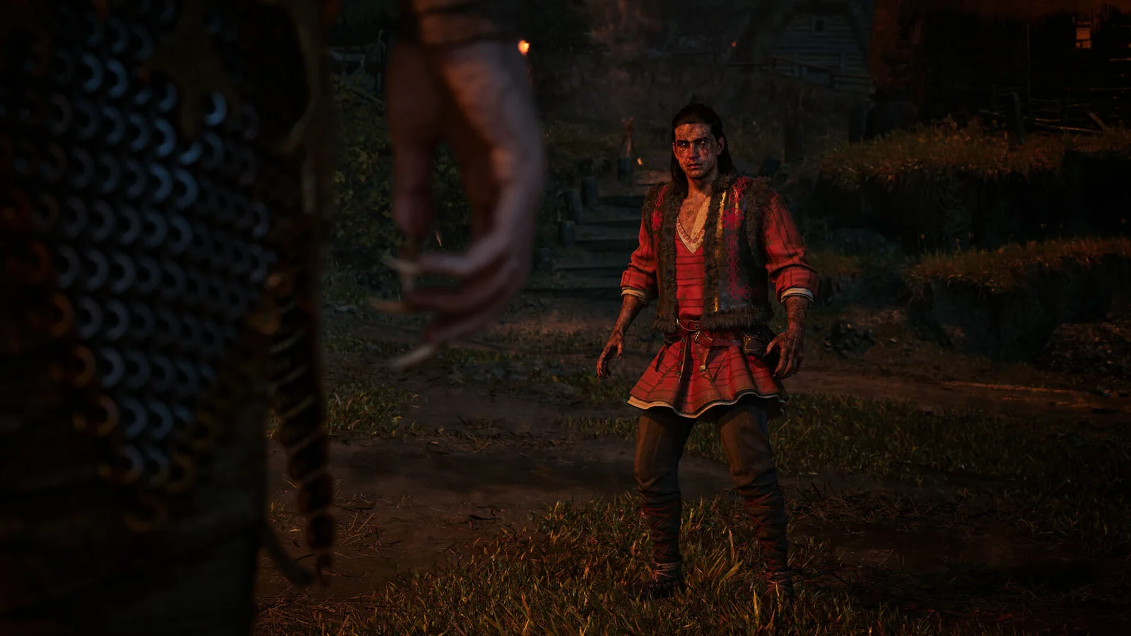 Official gameplay screenshot showing Coen standing in a dark outdoor settlement during a tense encounter