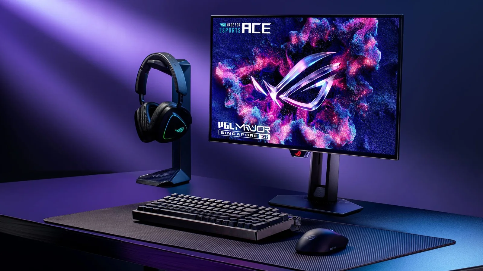 ROG Swift OLED PG259QWS Ace 720Hz monitor in a purple-lit gaming setup with keyboard, mouse and headset