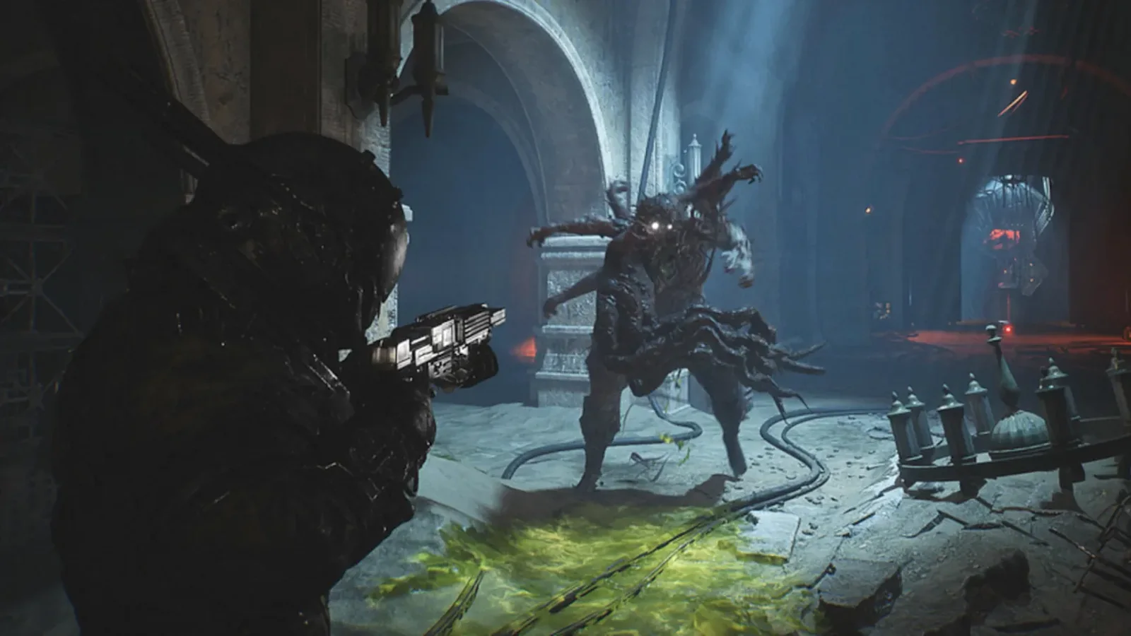 Armored protagonist aiming a futuristic firearm at a grotesque monster inside a ruined, cathedral-like chamber