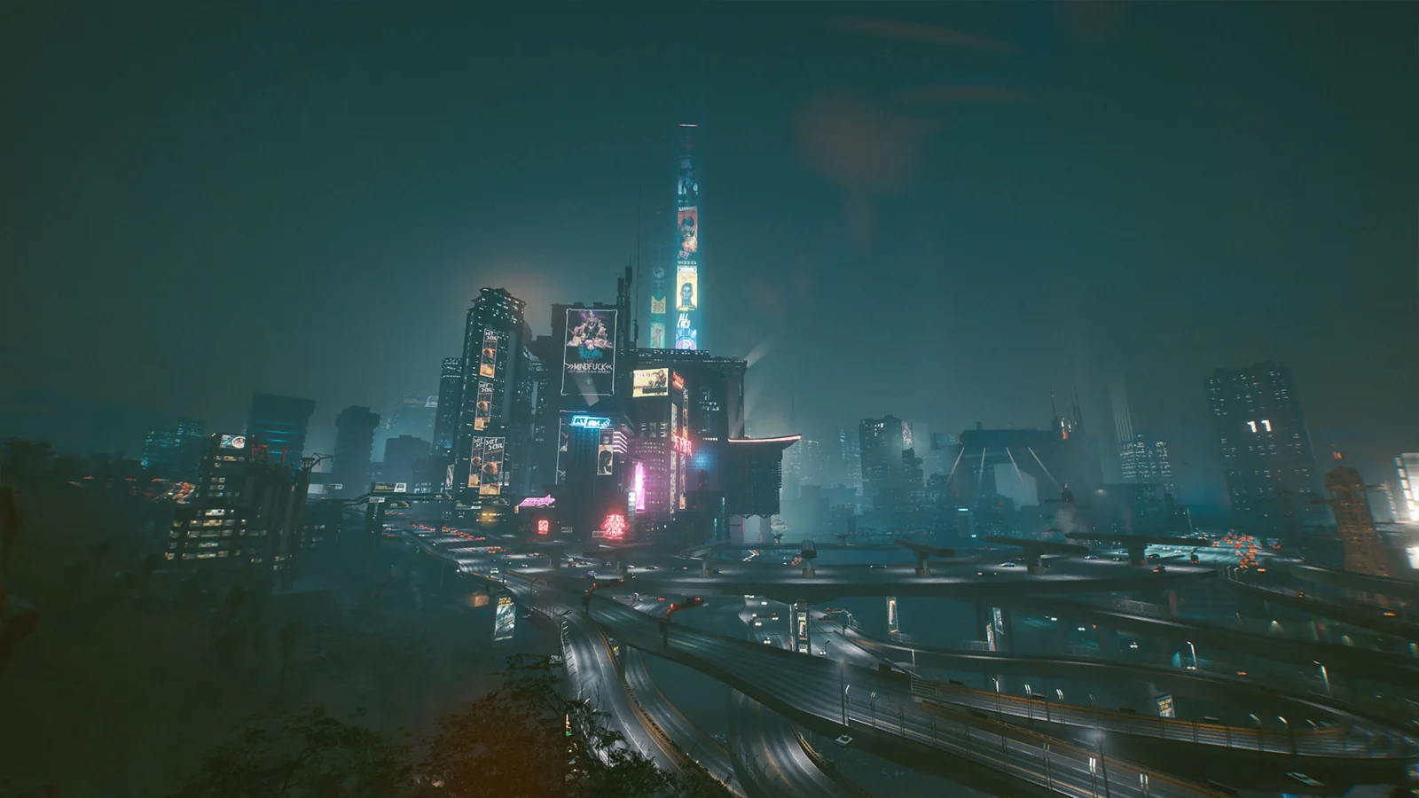 Cyberpunk 2077's Night City skyline at night, with illuminated megatowers, highways and glowing advertisements