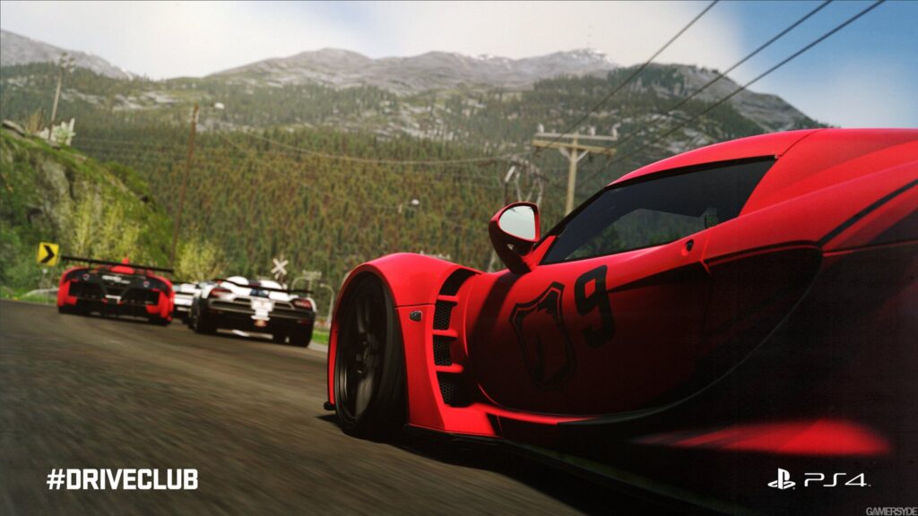 Three exotic racing cars navigating a scenic mountain highway surrounded by forests and distant mountains