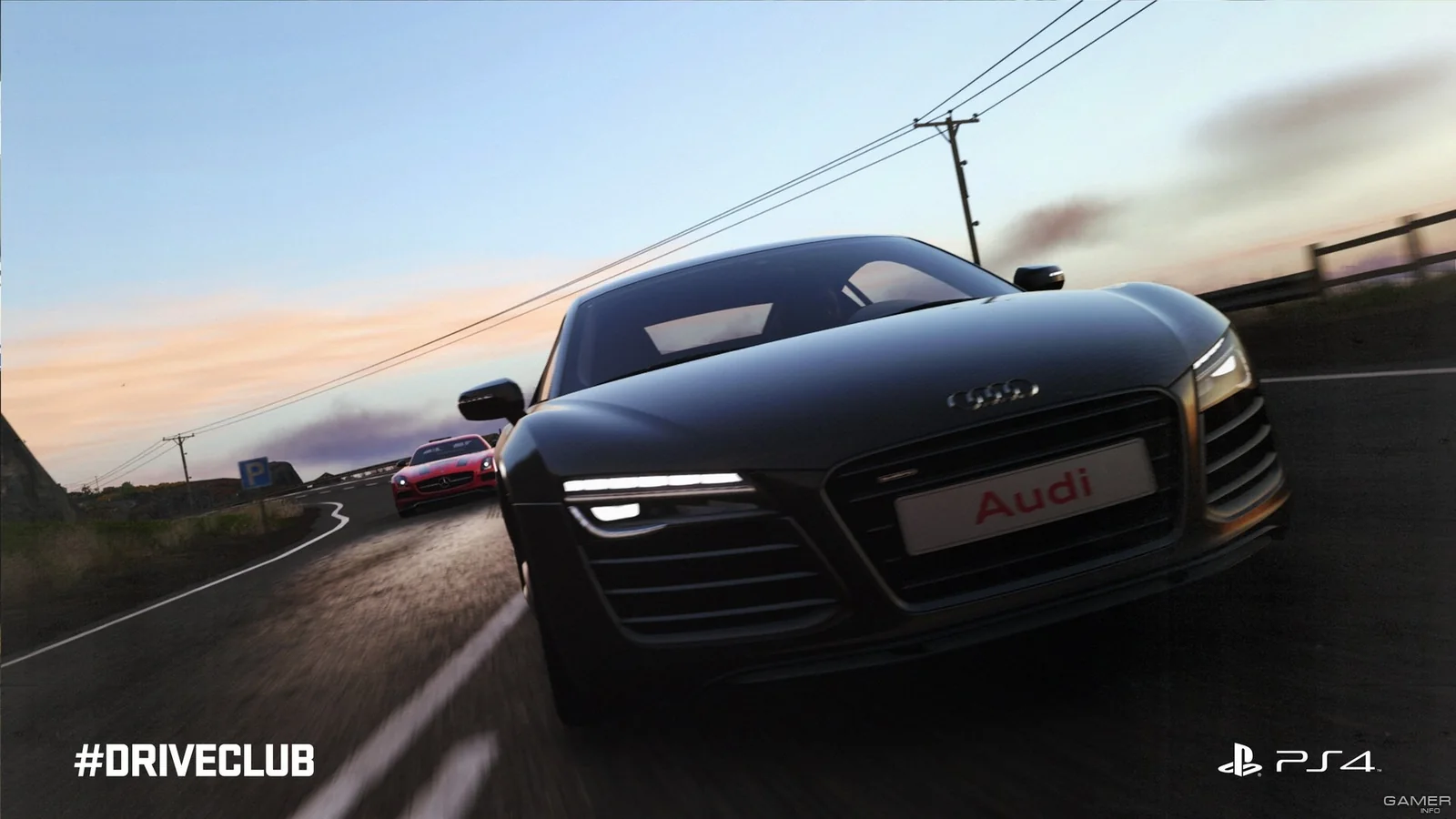 Black Audi R8 racing along a winding road at sunset with another sports car following behind