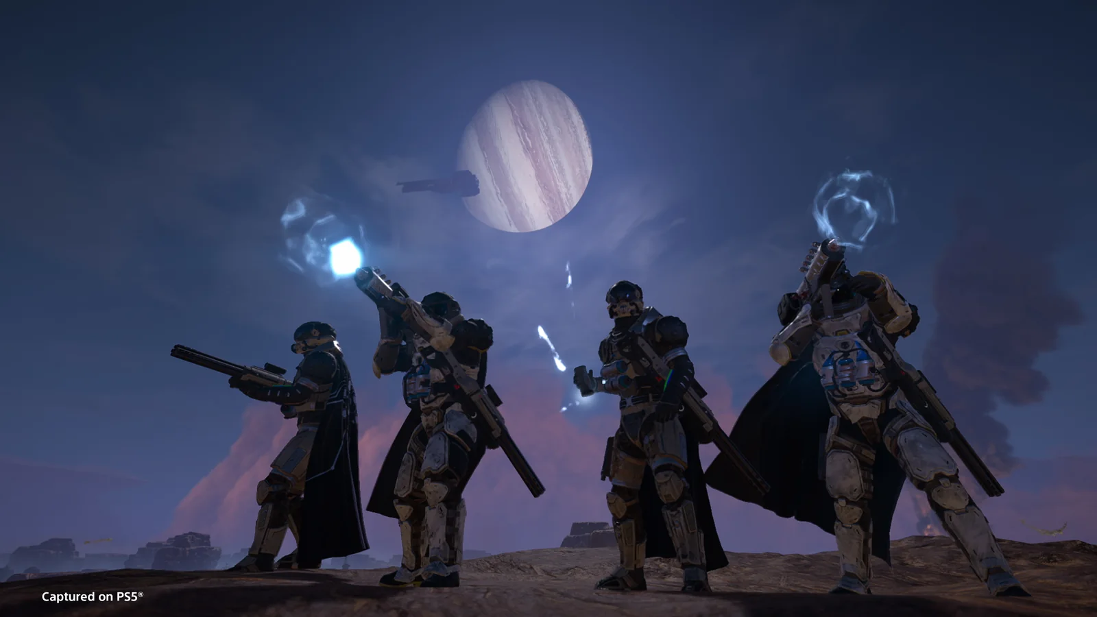 Helldivers standing beneath an alien planet against a dramatic purple twilight sky