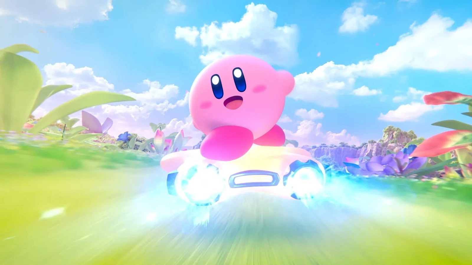 Kirby riding a glowing futuristic machine across a bright grassy landscape beneath a blue sky