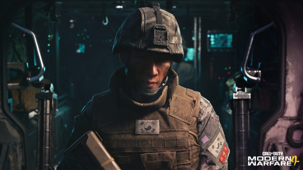 Modern Warfare 4 Benchmarks Show Radeon Ray Tracing Advantage Official Modern Warfare 4 campaign screenshot showing a South Korean soldier inside a dim military transport, with