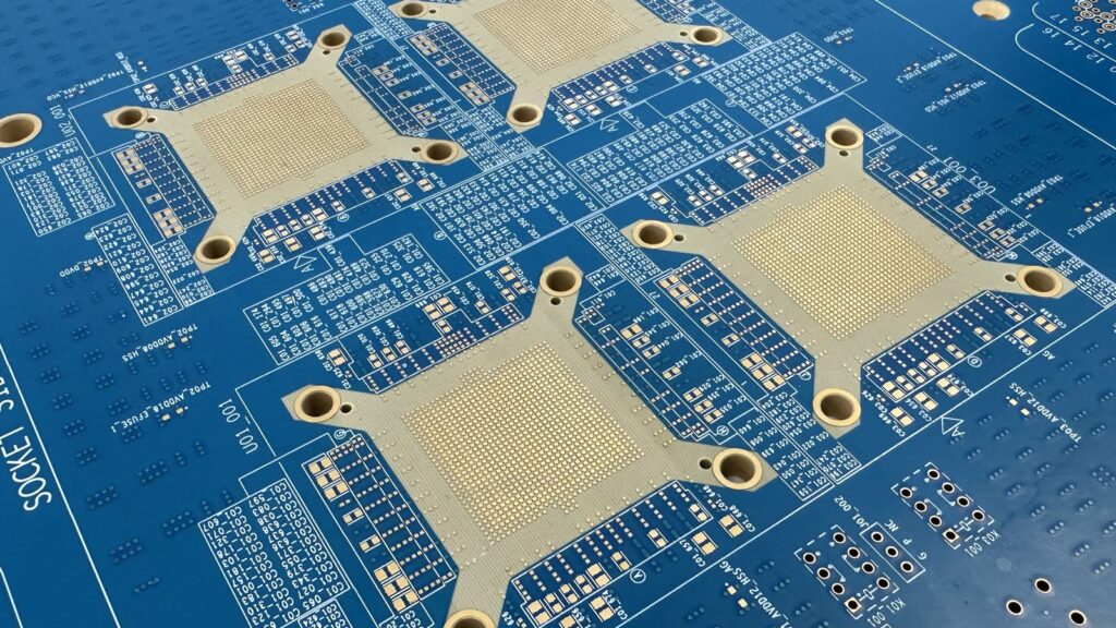 PCB Supply Shortage Could Push Up Gaming PC Hardware Prices Manufacturing technicians operating PCB processing equipment inside a yellow-lit cleanroom