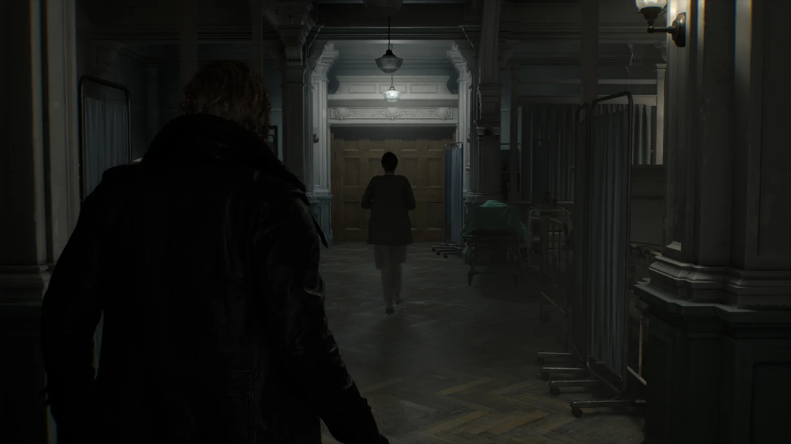 Leon follows Grace through a dark hospital corridor in Resident Evil Requiem