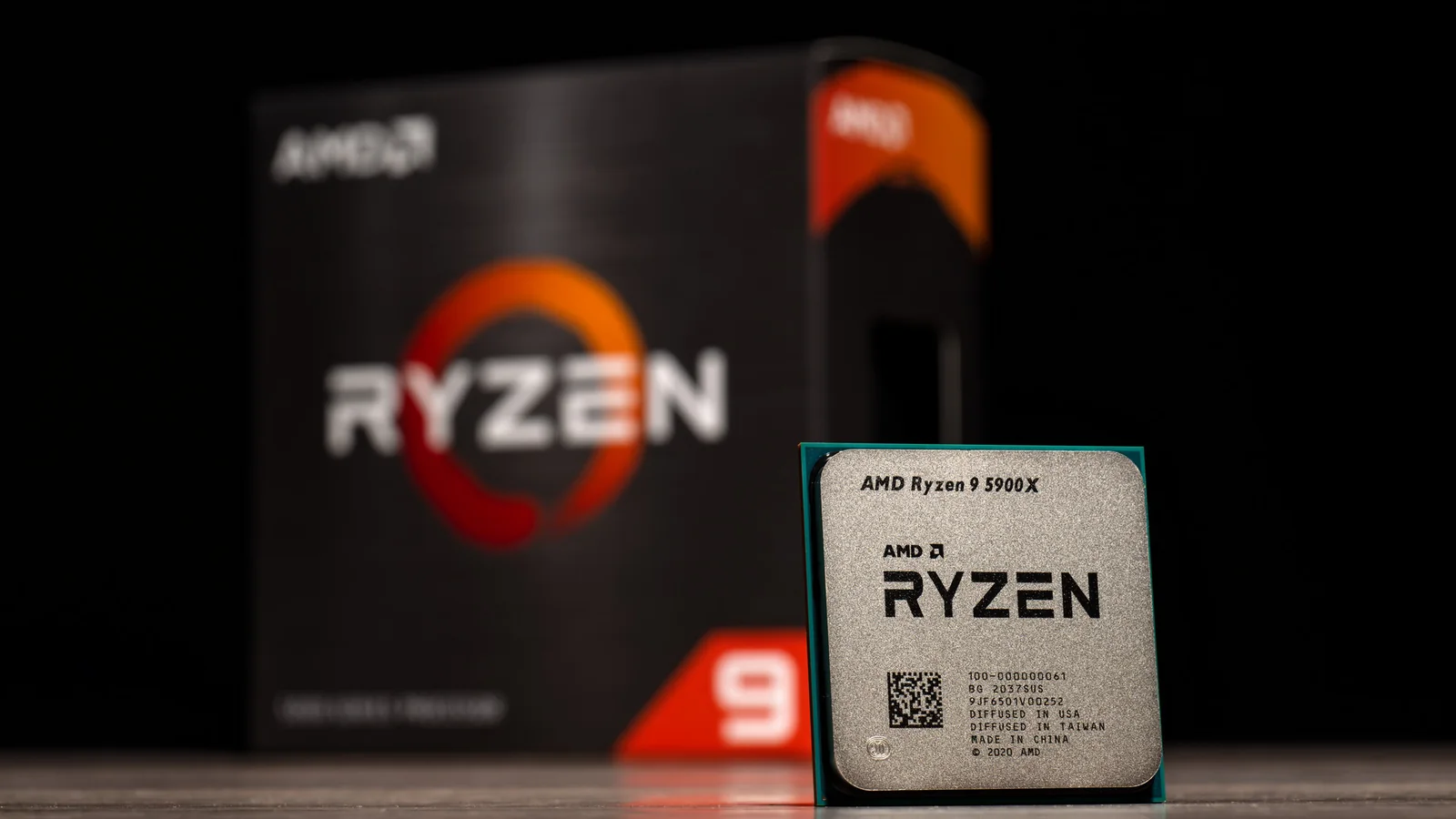 AMD Ryzen 9 5900X processor photographed upright against its Ryzen 9 retail packaging