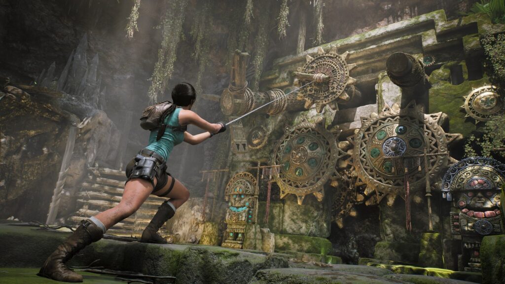 Lara Croft operates an elaborate ancient mechanism surrounded by stone architecture and vegetation