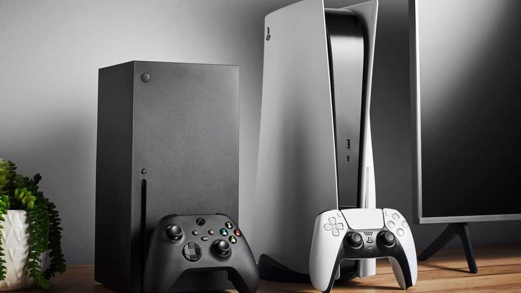 Xbox Sales Drop 33% as US Console Prices Hit Record Highs Xbox Series X and PlayStation 5 consoles standing side by side on a wooden surface, with their respective controllers